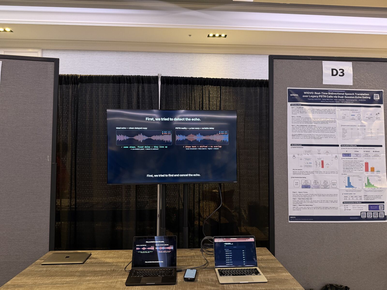 A WIGTN engineer explaining the WIGVO system to visitors at the demo booth.